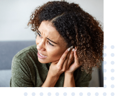 Woman in discomfort from ringing in her ears